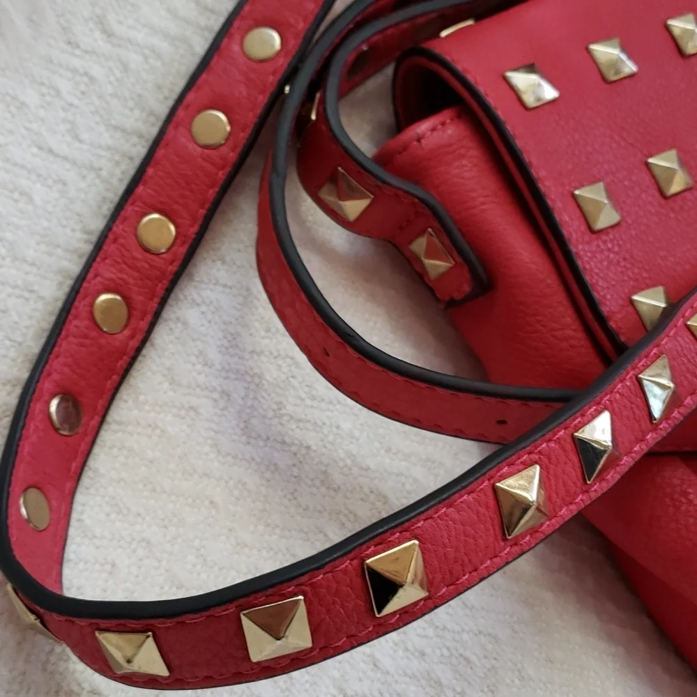 RED studded-embellished lipstick red vegan leather shoulder bag